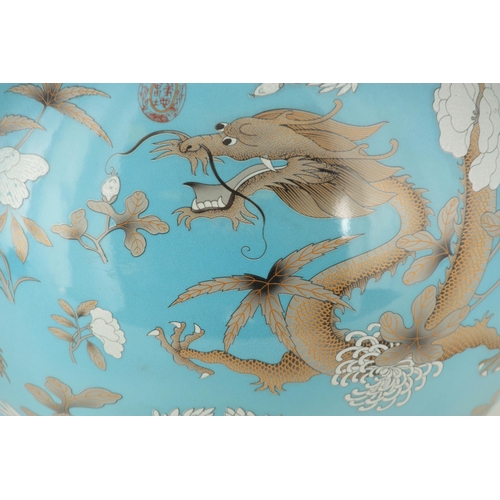 317 - A MASSIVE 20TH CENTURY CHINESE BULBOUS VASE WITH SLENDER NECK pale blue ground with scrolled leaf de... 