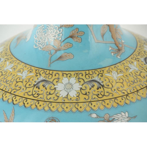 317 - A MASSIVE 20TH CENTURY CHINESE BULBOUS VASE WITH SLENDER NECK pale blue ground with scrolled leaf de... 