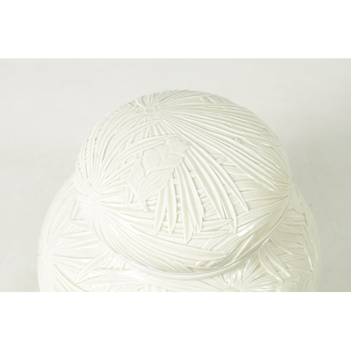 326 - A LARGE JAPANESE MEIJI PERIOD PALE CELADON GLAZE POTTERY VASE AND COVER with overall relief moulded ... 