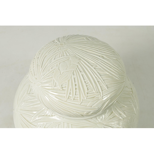 326 - A LARGE JAPANESE MEIJI PERIOD PALE CELADON GLAZE POTTERY VASE AND COVER with overall relief moulded ... 