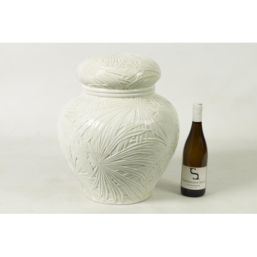 326 - A LARGE JAPANESE MEIJI PERIOD PALE CELADON GLAZE POTTERY VASE AND COVER with overall relief moulded ... 