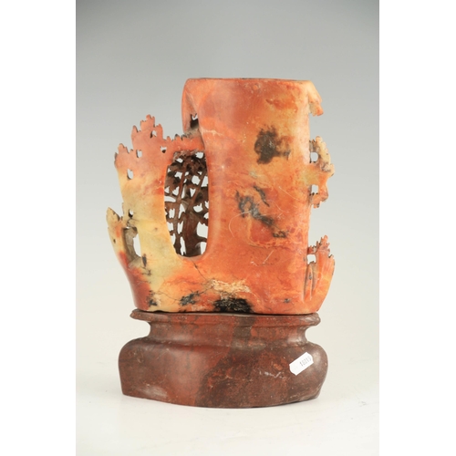 329 - A LATE 19TH CENTURY CHINESE SOAPSTONE VASE ON STAND with finely carved woodland animals amongst tree... 