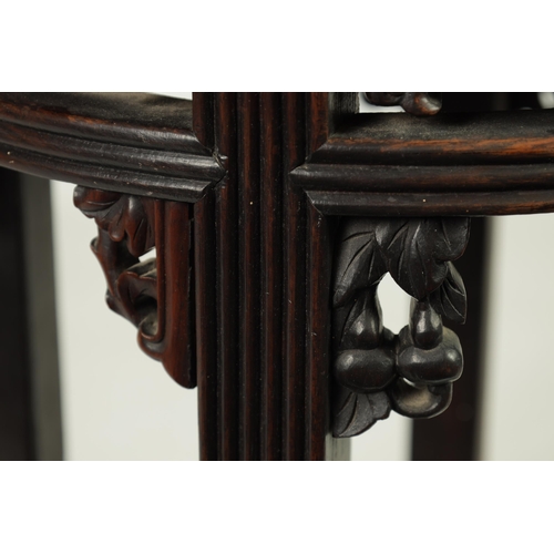 335 - A 19TH CENTURY CHINESE HARDWOOD CIRCULAR JARDINERE TABLE with inset marble top and geometric pierced... 