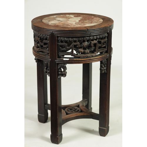 335 - A 19TH CENTURY CHINESE HARDWOOD CIRCULAR JARDINERE TABLE with inset marble top and geometric pierced... 