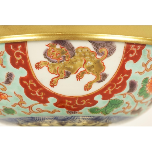 336 - AN ORMOLU MOUNTED CHINESE BOWL pale blue ground with floral decoration enclosing foo dog panels, the... 