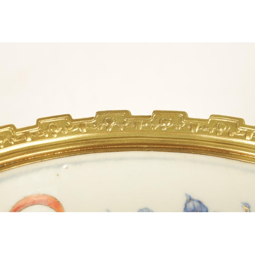 336 - AN ORMOLU MOUNTED CHINESE BOWL pale blue ground with floral decoration enclosing foo dog panels, the... 