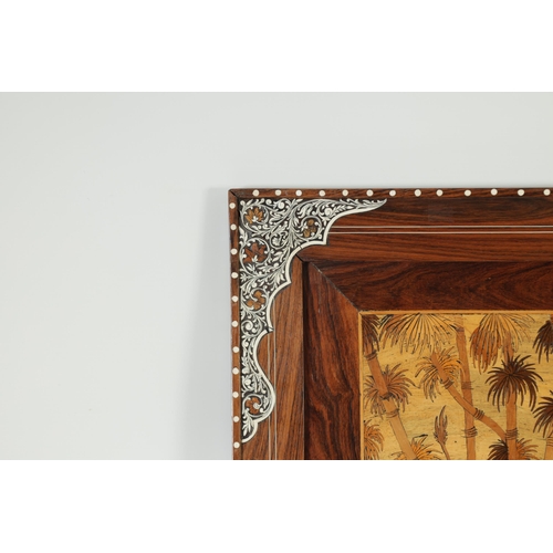 351 - AN EARLY 20TH CENTURY INDIAN MARQUETRY INLAID HARDWOOD PANEL the centre finely inlaid with a coloure... 