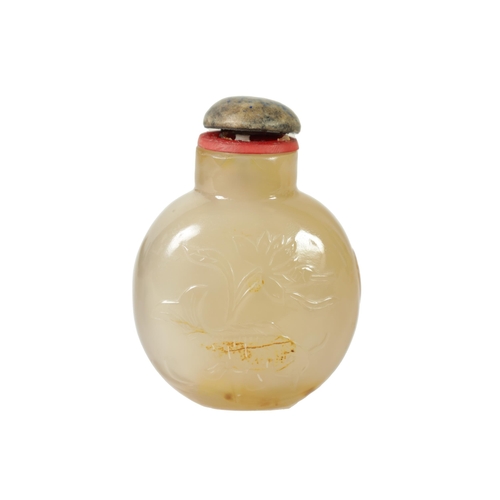 356 - A 19TH CENTURY CHINESE SMOKED GLASS SNUFF BOTTLE the shouldered flattened body carved with swimming ... 