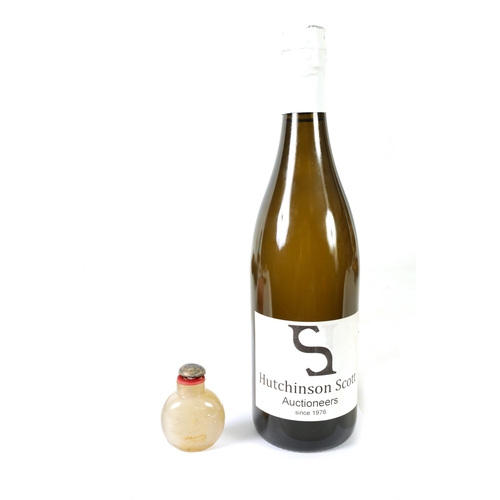 356 - A 19TH CENTURY CHINESE SMOKED GLASS SNUFF BOTTLE the shouldered flattened body carved with swimming ... 