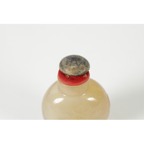 356 - A 19TH CENTURY CHINESE SMOKED GLASS SNUFF BOTTLE the shouldered flattened body carved with swimming ... 