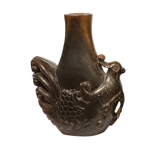 352 - A CHINESE CARVED RHINOCEROS HORN SNUFF BOTTLE modelled as an exotic bird with pierced tail feathers.