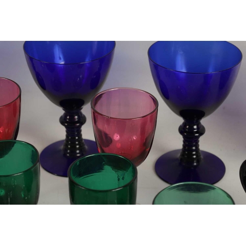 11 - A LARGE COLLECTION OF COLOURED GLASSWARE comprising a `Georgian Bristol blue squat Jug, three later ... 
