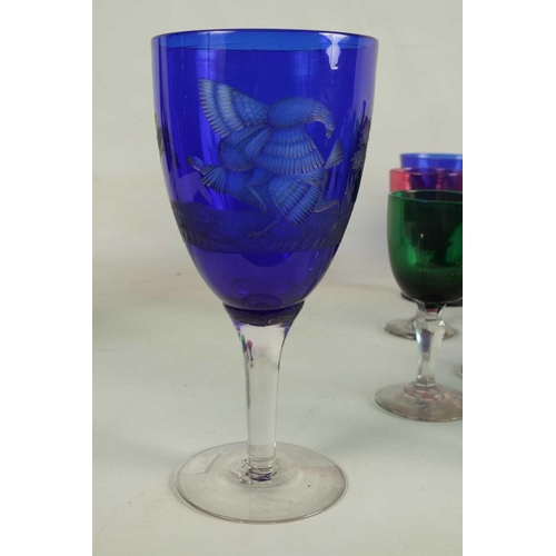 11 - A LARGE COLLECTION OF COLOURED GLASSWARE comprising a `Georgian Bristol blue squat Jug, three later ... 