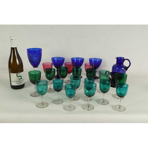 11 - A LARGE COLLECTION OF COLOURED GLASSWARE comprising a `Georgian Bristol blue squat Jug, three later ... 