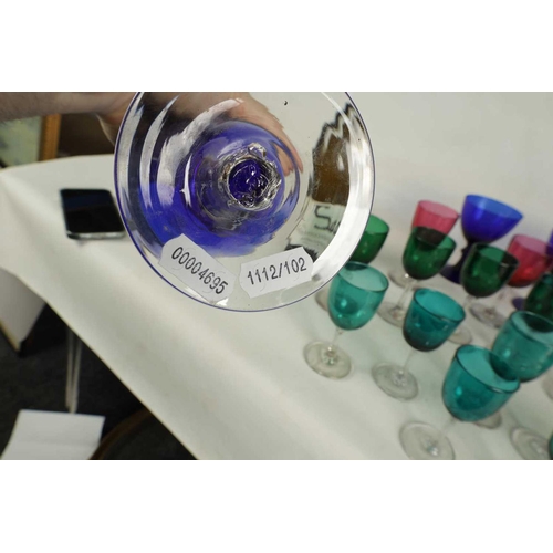 11 - A LARGE COLLECTION OF COLOURED GLASSWARE comprising a `Georgian Bristol blue squat Jug, three later ... 