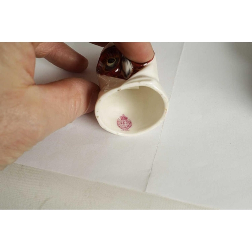 20 - A COLLECTION OF ROYAL WORCESTER CANDLE EXTINGUISHERS circa 1880, 1909 and 1925 comprising of Dog in ... 