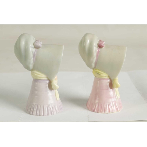 22 - OLD WOMAN AND YOUNG GIRL TWO ROYAL WORCESTER CANDLE EXTINGUISHERS Attributed to James Hadley, both w... 