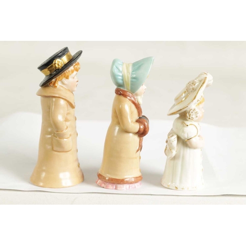 32 - GIRL WITH MUFF AND BOY WITH BOATER. A PAIR OF ROYAL WORCESTER CANDLE EXTINGUISHERS circa 1881 the bo... 