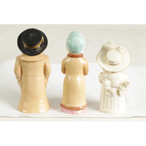 32 - GIRL WITH MUFF AND BOY WITH BOATER. A PAIR OF ROYAL WORCESTER CANDLE EXTINGUISHERS circa 1881 the bo... 