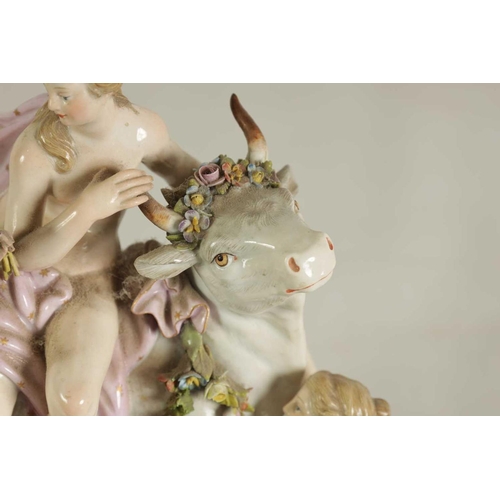 49 - A 19TH CENTURY MEISSEN FIGURE GROUP OF A BULL WITH A SEATED LADY RIDER AND A FLOWER SELLER finely mo... 