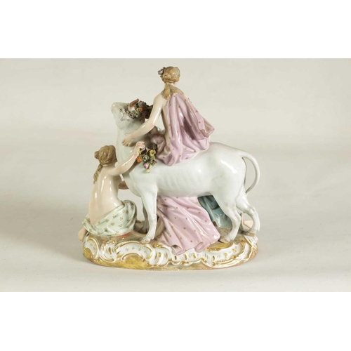 49 - A 19TH CENTURY MEISSEN FIGURE GROUP OF A BULL WITH A SEATED LADY RIDER AND A FLOWER SELLER finely mo... 