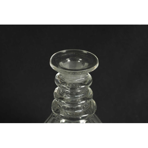5 - A PAIR OF 19TH CENTURY CUT GLASS DECANTERS with bulls-eye stoppers, triple ringed necks and hobnail-... 