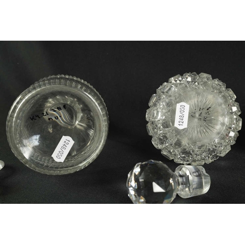 5 - A PAIR OF 19TH CENTURY CUT GLASS DECANTERS with bulls-eye stoppers, triple ringed necks and hobnail-... 