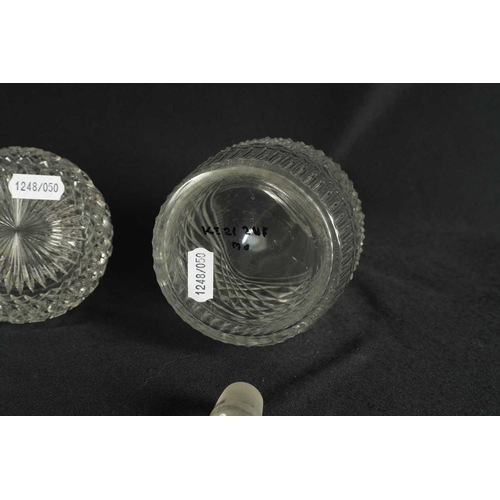 5 - A PAIR OF 19TH CENTURY CUT GLASS DECANTERS with bulls-eye stoppers, triple ringed necks and hobnail-... 