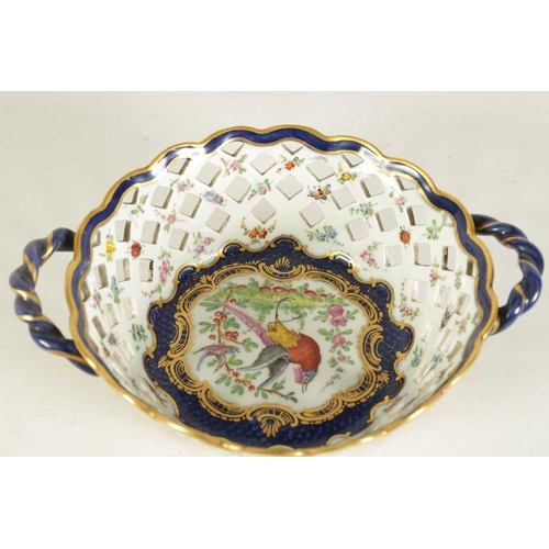 53 - A 19TH CENTURY FIRST PERIOD WORCESTER TYPE TWO-HANDLED LATTICEWORK BASKET decorated in blue and gilt... 