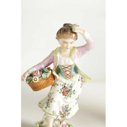 54 - A PAIR OF LATE 19TH CENTURY SITZENDORF PORCELAIN SEATED FIGURES depicting flower sellers dressed in ... 