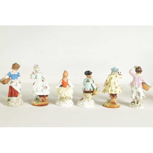 54 - A PAIR OF LATE 19TH CENTURY SITZENDORF PORCELAIN SEATED FIGURES depicting flower sellers dressed in ... 