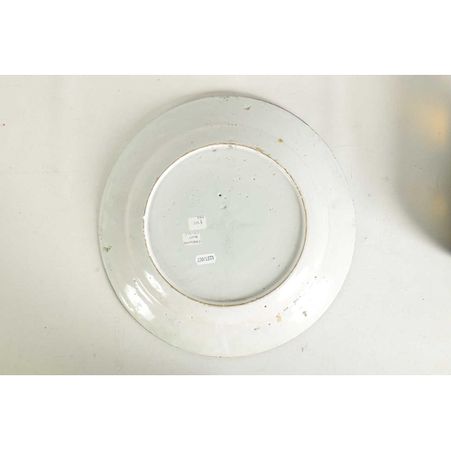 55 - AN 18TH-CENTURY DELFT BLUE AND WHITE PLATE with scrolled spired border enclosing a formal fenced gar... 