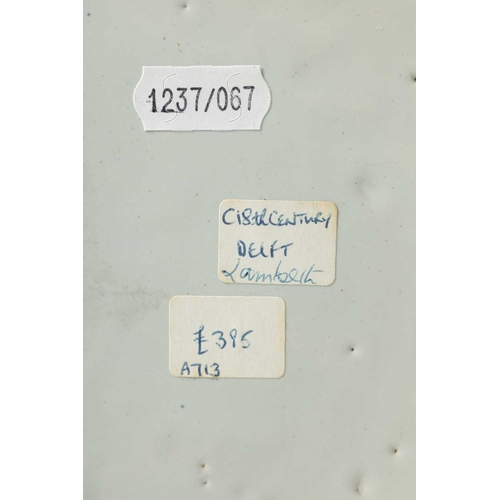 55 - AN 18TH-CENTURY DELFT BLUE AND WHITE PLATE with scrolled spired border enclosing a formal fenced gar... 