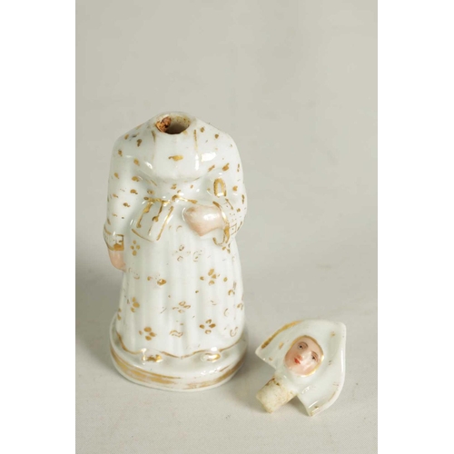 59 - A LATE 19TH CENTURY CONTINENTAL FIGURE OF A STANDING NUN formed as a scent bottle with detachable he... 