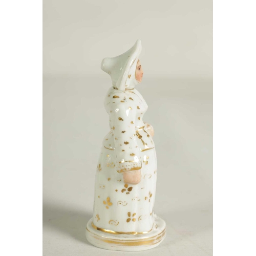 59 - A LATE 19TH CENTURY CONTINENTAL FIGURE OF A STANDING NUN formed as a scent bottle with detachable he... 