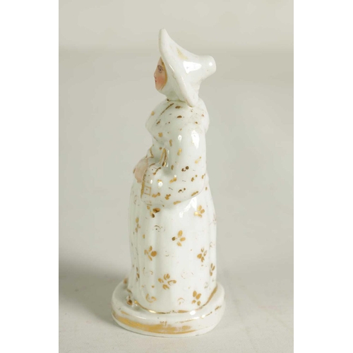 59 - A LATE 19TH CENTURY CONTINENTAL FIGURE OF A STANDING NUN formed as a scent bottle with detachable he... 