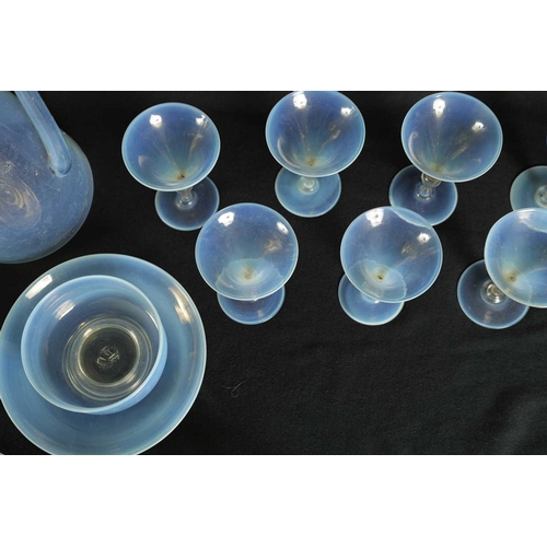 6 - A COLLECTION OF LATE 19TH CENTURY VASELINE GLASSWARE comprising a water jug and glasses etc (27.5cm ... 