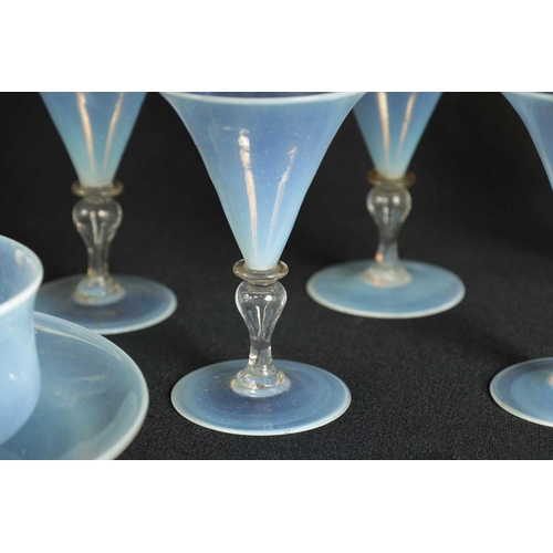 6 - A COLLECTION OF LATE 19TH CENTURY VASELINE GLASSWARE comprising a water jug and glasses etc (27.5cm ... 