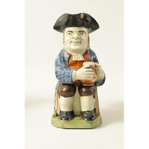 90 - A LATE 18TH/EARLY 19TH CENTURY PRATT TYPE TOBY JUG the well modelled seated figure holding a foaming... 