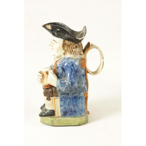 90 - A LATE 18TH/EARLY 19TH CENTURY PRATT TYPE TOBY JUG the well modelled seated figure holding a foaming... 