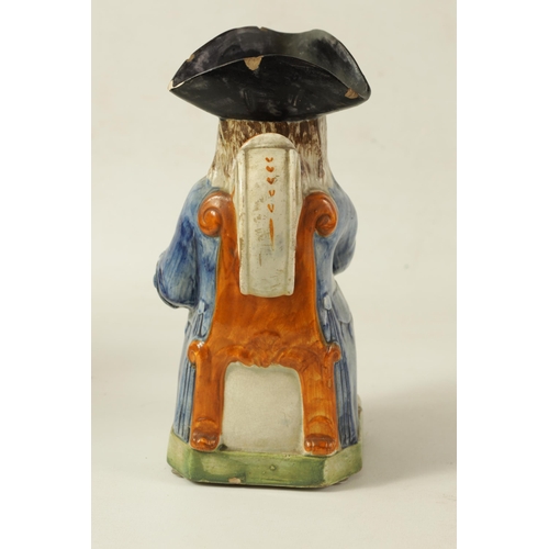 90 - A LATE 18TH/EARLY 19TH CENTURY PRATT TYPE TOBY JUG the well modelled seated figure holding a foaming... 