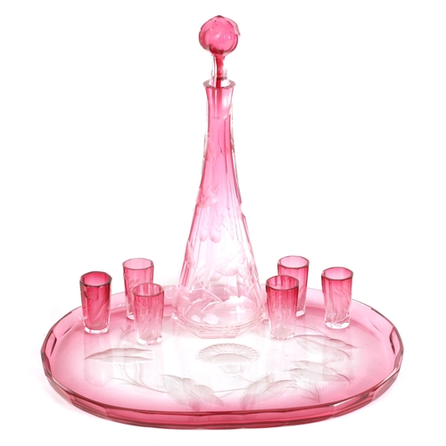 11 - AN ART NOUVEAU RUBY AND CLEAR GLASS MOSER DECANTER, TRAY AND SIX GLASSES deeply cut with intaglio de... 