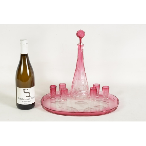 11 - AN ART NOUVEAU RUBY AND CLEAR GLASS MOSER DECANTER, TRAY AND SIX GLASSES deeply cut with intaglio de... 