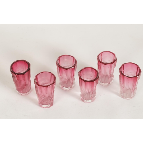 11 - AN ART NOUVEAU RUBY AND CLEAR GLASS MOSER DECANTER, TRAY AND SIX GLASSES deeply cut with intaglio de... 