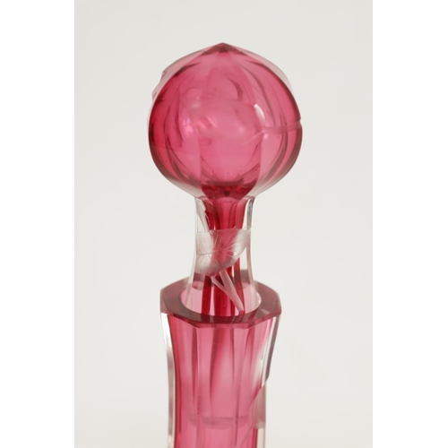 11 - AN ART NOUVEAU RUBY AND CLEAR GLASS MOSER DECANTER, TRAY AND SIX GLASSES deeply cut with intaglio de... 