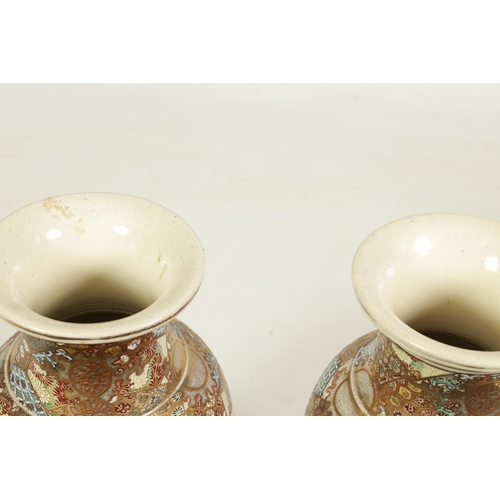 112 - A PAIR OF JAPANESE MEIJI PERIOD SATSUMA SHOULDERED TAPERING VASES richly gilt and decorated with cou... 