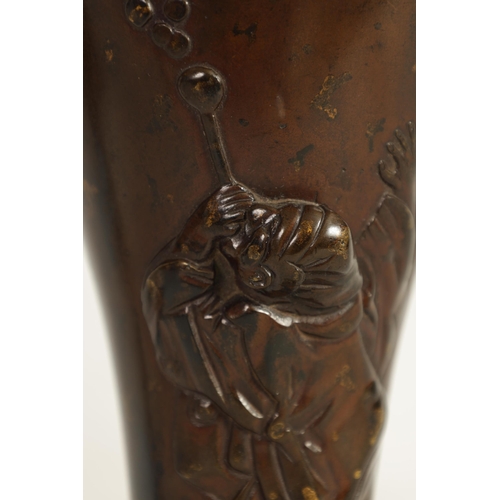 113 - A JAPANESE MEIJI PERIOD PATINATED BRONZE VASE of slender baluster form decorated with gilt masks to ... 