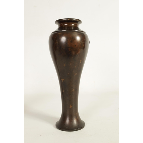 113 - A JAPANESE MEIJI PERIOD PATINATED BRONZE VASE of slender baluster form decorated with gilt masks to ... 