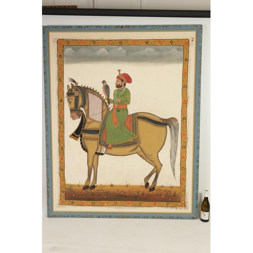 117 - A 19TH CENTURY INDIAN WARECOLOUR AND INK PAINTING ON SILK OF GURU GOBIND SINGH ON HORSE BACK holding... 