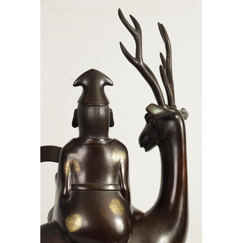 119 - A LARGE PAIR OF LATE 19TH CENTURY PATINATED BRONZE KOROS both modelled as a sage seated on a stag re... 